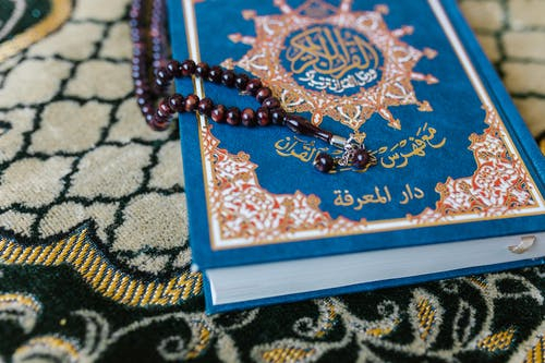 Quran on a prayer mat