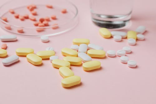 Yellow white and red prescription medication