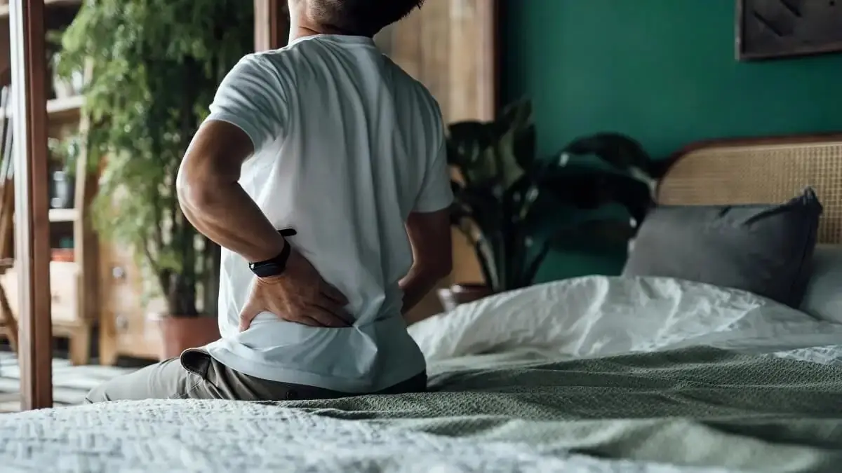 photo of a man suffering from back pain