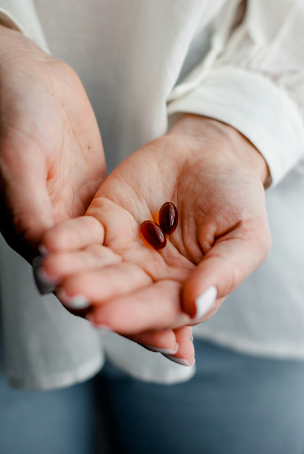 image a a pharmacist with open hands revealing medication