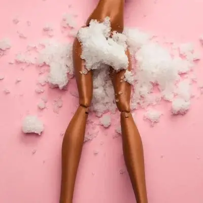 photo of a doll with sugar sprinkled on it representing a yeast infection