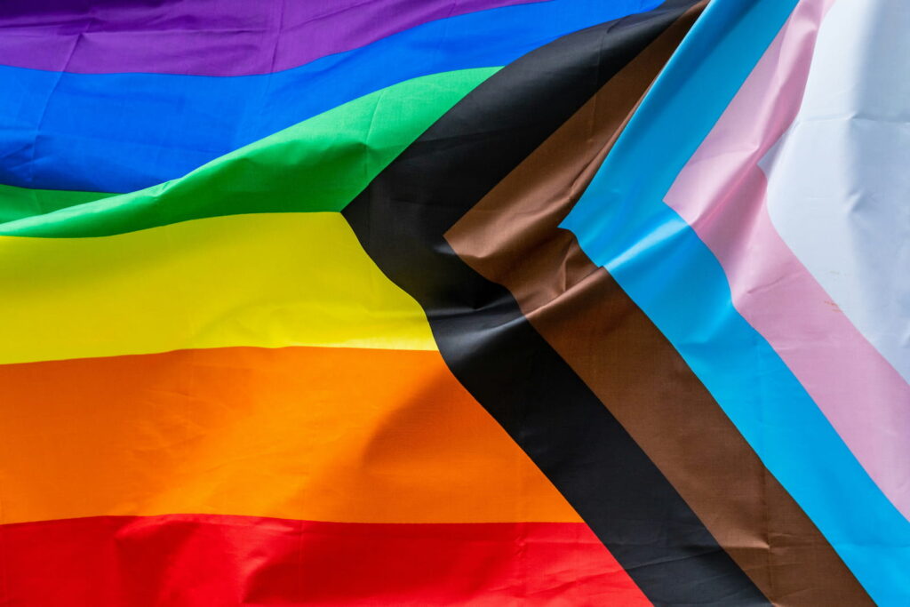 a photo of the pride flag blowing in the wind