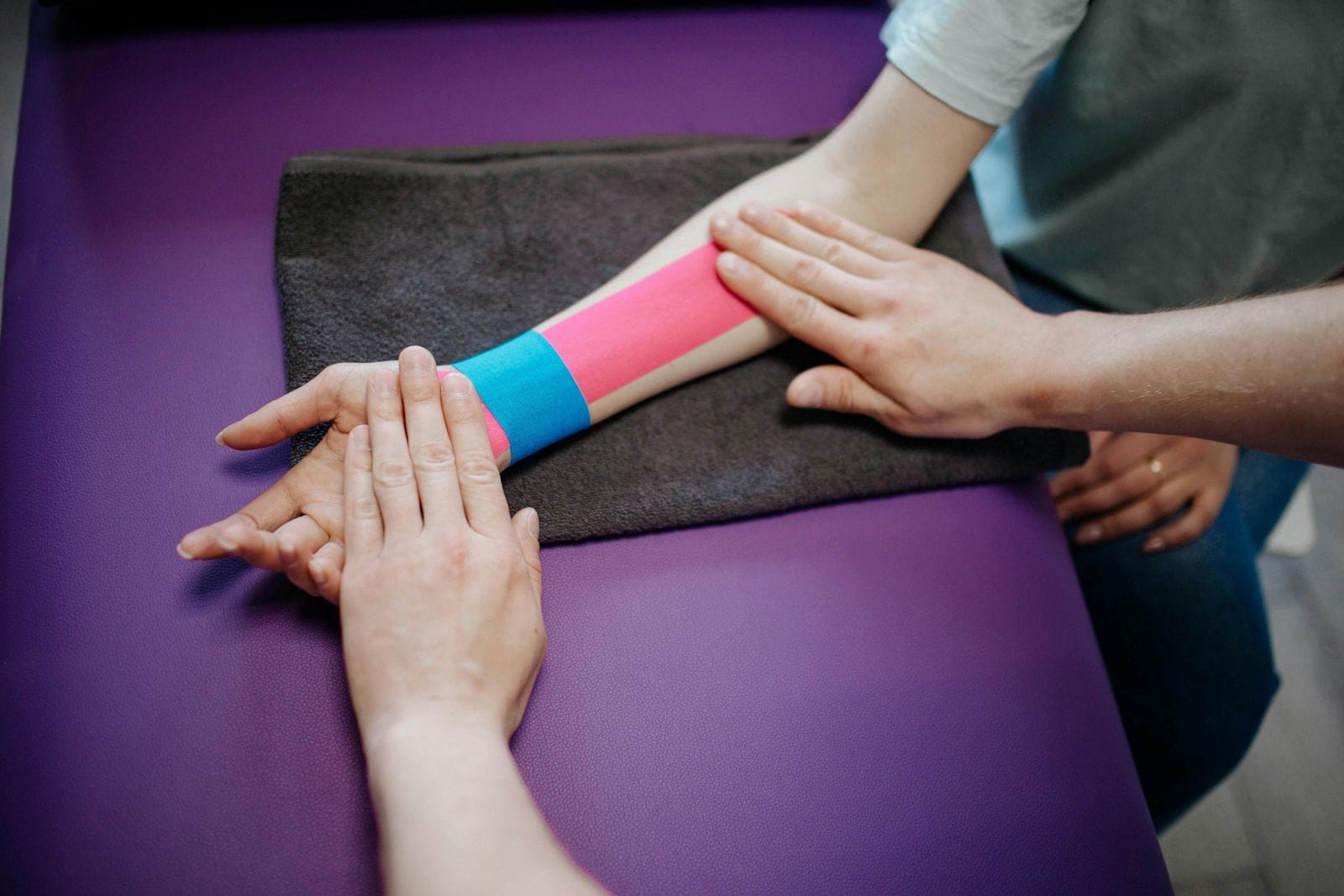 photo of tape being applied to a sprained or strained wrist - treatable by a Centrum Pharmacist in the Ottawa and Orleans area