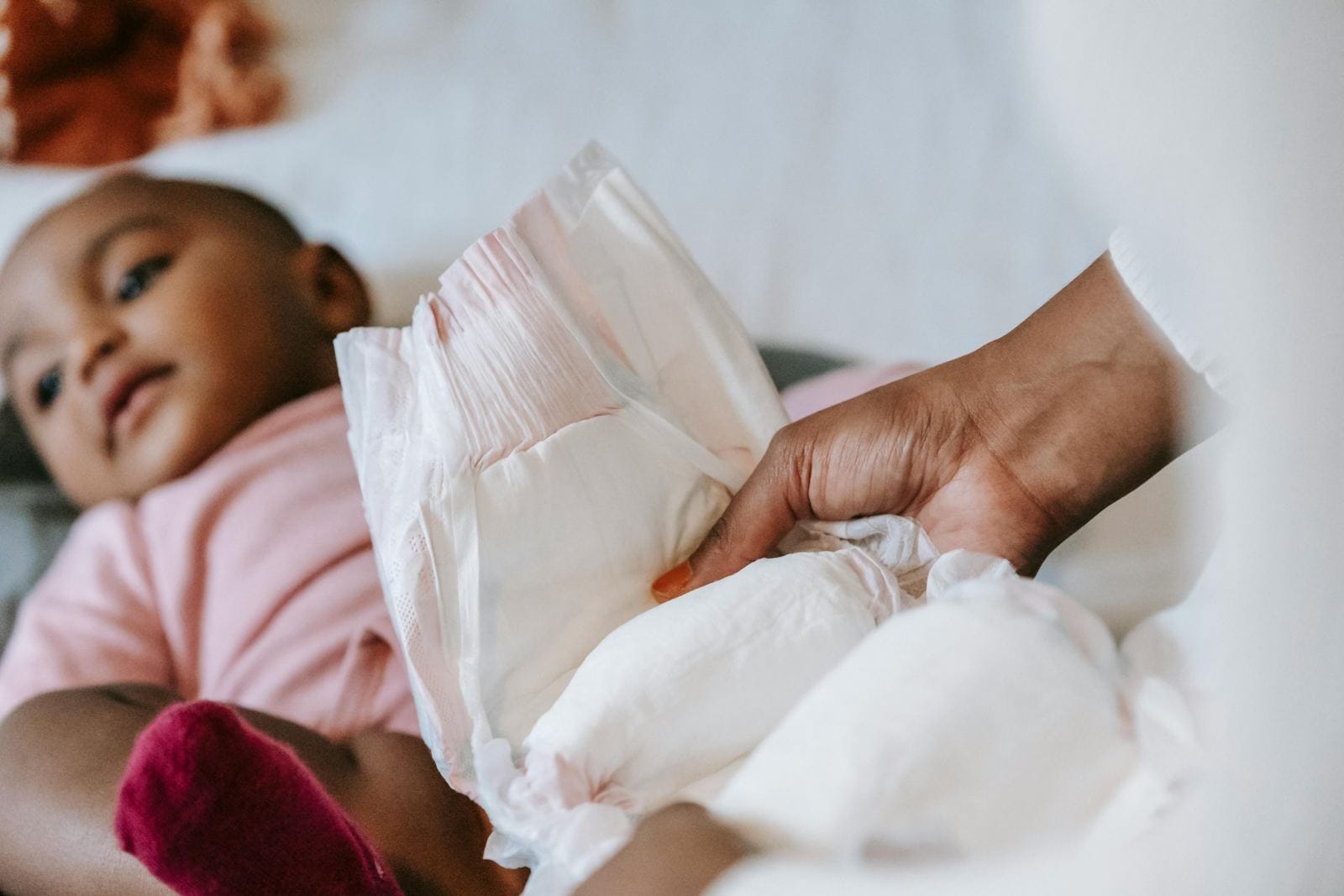 photo of a child having their diaper changed representing diaper dermatitis or diaper rash - treatable by a centrum pharmacist in Ottawa and Orleans