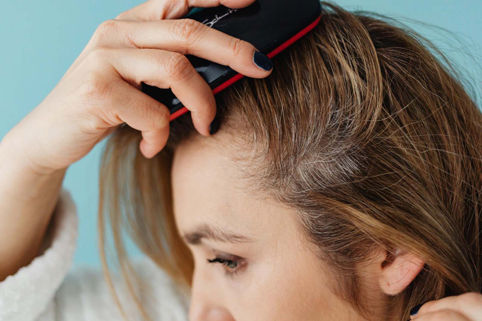 Minor Ailment patient checking for dandruff and scalp health

