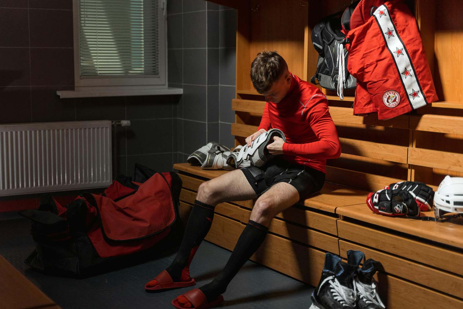 A hockey player in a locker room representing jock itch.